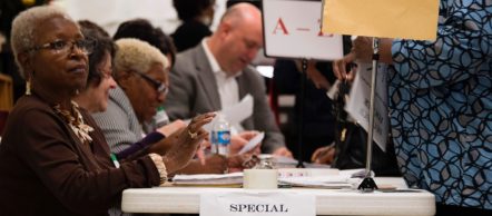 A volunteer checks off voters as they arrive at the Beulah Baptist Church polling station in Montgomery, Alabama, on Dec. 12, 2017.