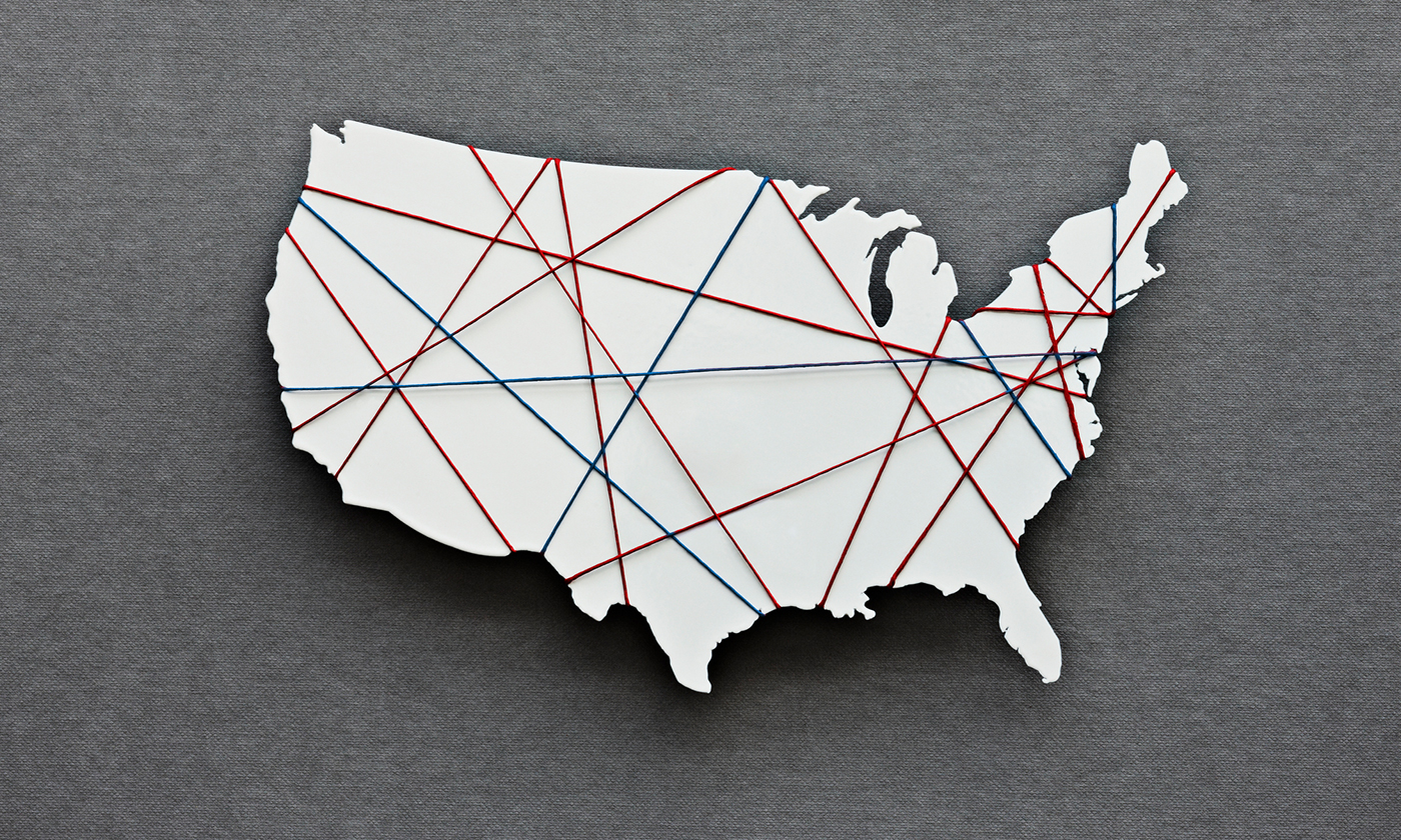 A map of the United States, divided by threads representing different political parties.