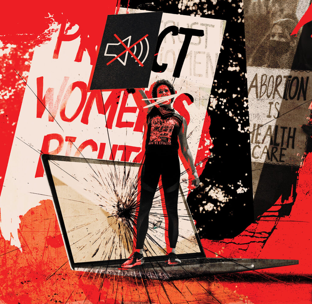 A photo illustration depicts a woman holding a sign that shows a "mute" symbol. She is standing on top of a laptop with a shattered screen. Other protest signs are visible in the background.