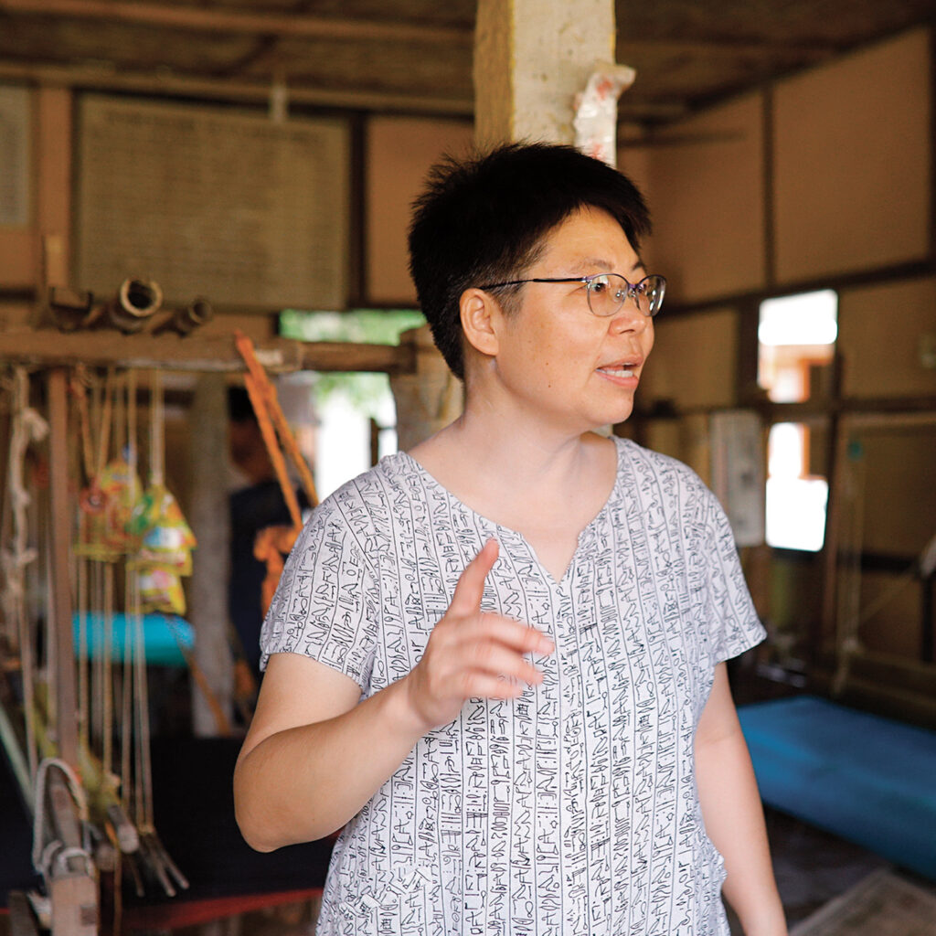 Jennifer Liang, a short-haired woman with glasses from the Chirang district of Assam, India, co-founded the The Ant in 2000, a nonprofit to support child protection, women’s empowerment, peace building, and mental health