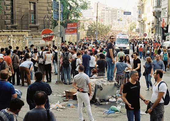 A dense crowd flowing into Taksim Square parts to let an ambulance through on June 1