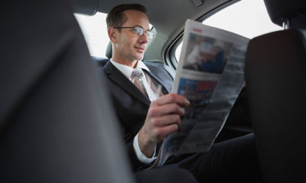 Businessman Reading Newspaper photo from Shutterstock
