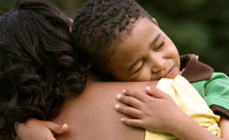 Boy Hugging Mother photo by Studio 1One/Shutterstock