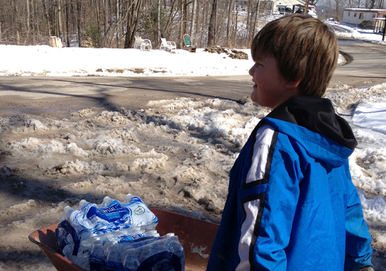 Bryson Spencer delivers water in West Virginia. Photo by Jackson Kusiak.