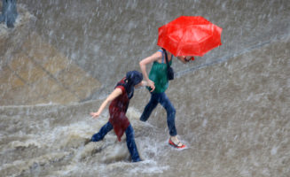 Walking in rain by Portokalis.