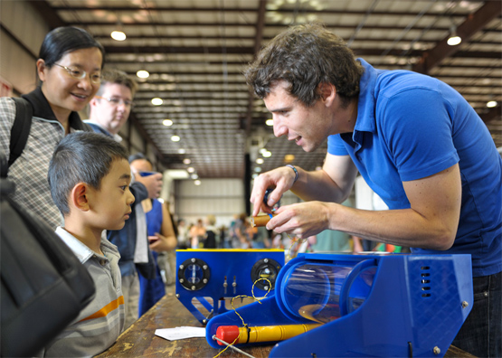 Eric Stackpole demonstrates an open-source underwater robot.