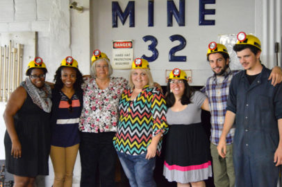 Appalachian Transition Fellows in mining helmets.