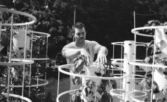 Joel McKinney with hydroponic towers