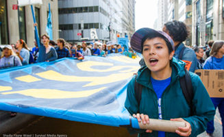 The author marches in the Flood Wall Street demonstration. Photo by Shadia Fayne-Wood / Project Survival Media.