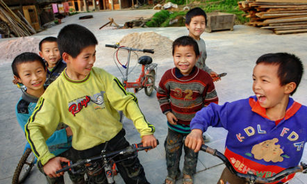 Chinese boys laughing in Guizhou province. Photo by Grigvovan / Shutterstock.com.
