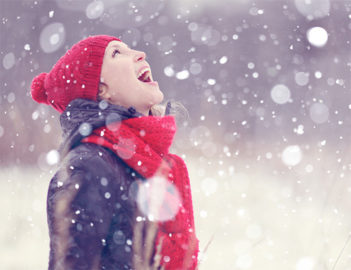 Woman in snow by Shutterstock