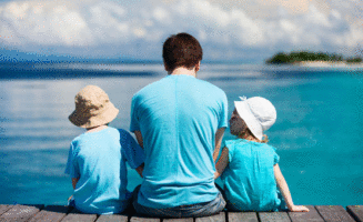 Dad and Kids at Beach photo by Shutterstock