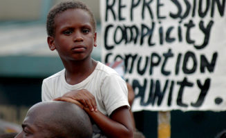 Boy at demonstration for Trayvon Martin